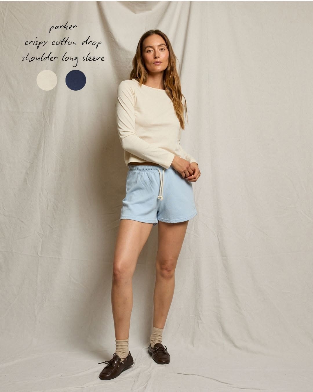 Cream off-white crispy cotton drop shoulder long sleeve top with relaxed fit and round neckline