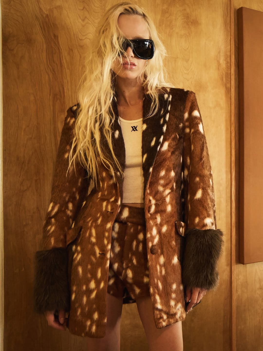 Brown deer-print faux fur blazer with solid dark brown lapels and cuffs, single-button closure.