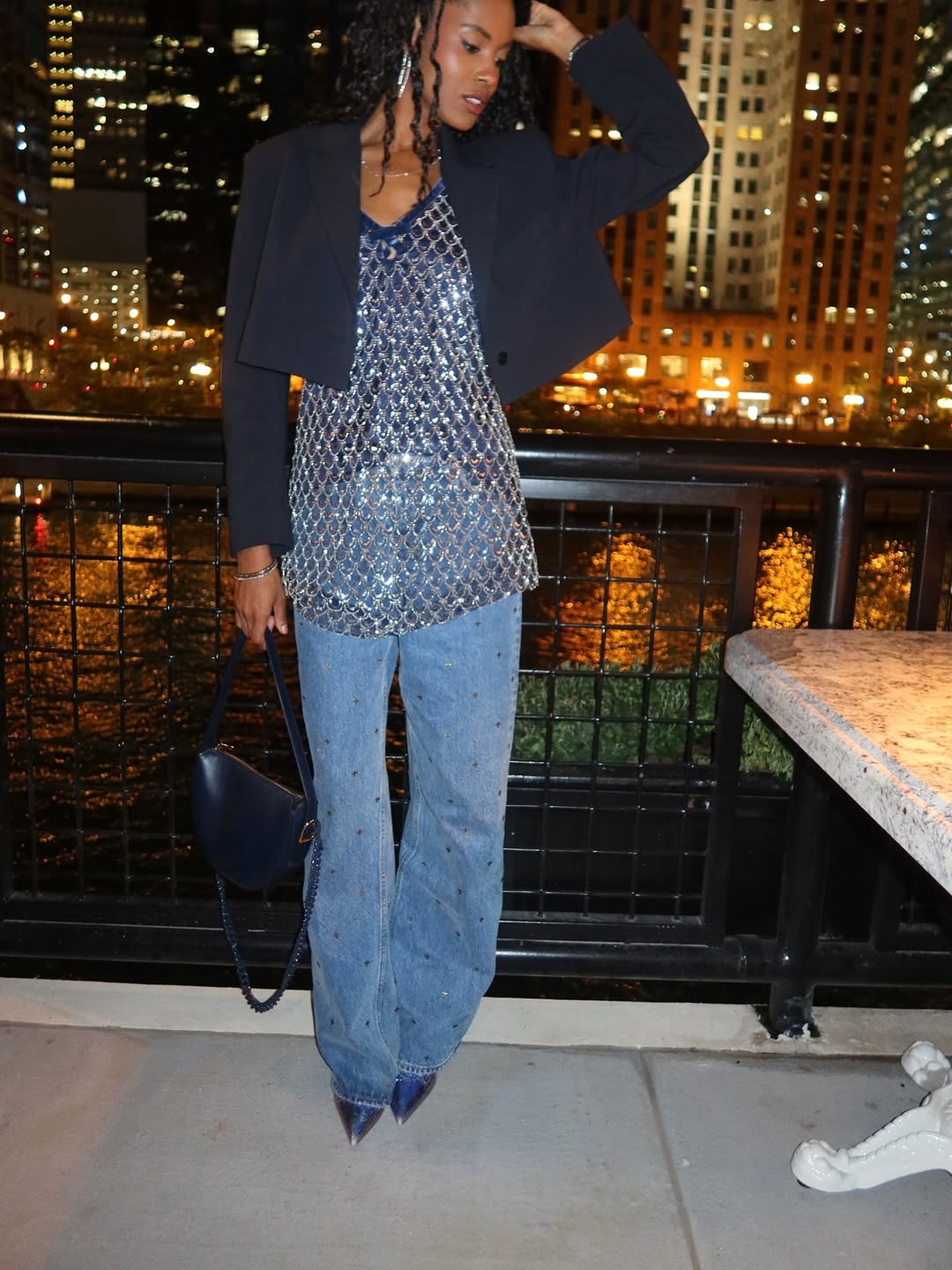 A sleeveless, V-neck top covered entirely in small silver sequins arranged in a repeating diamond or scale-like pattern.